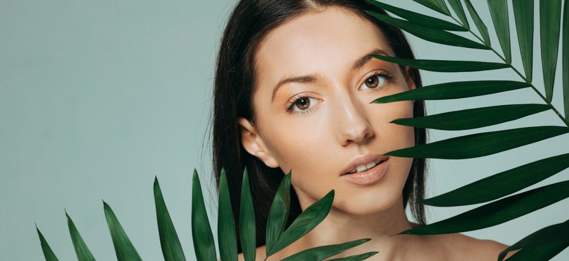 brunette-girl-posing-with-exotic-leaves brunette-girl-posing-with-exotic-leaves